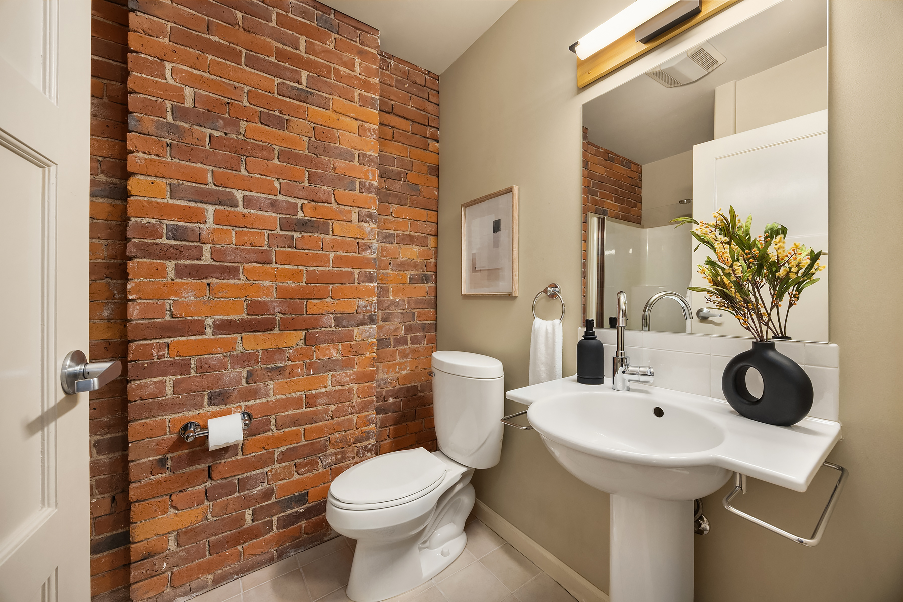 Industrial loft interior with exposed brick and timber beams