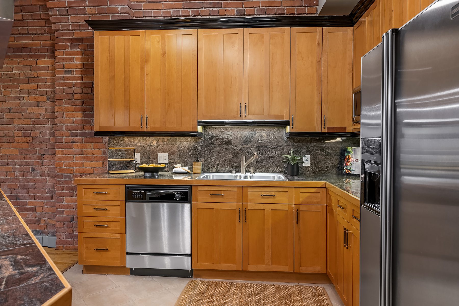 Living room pivot windows and brick