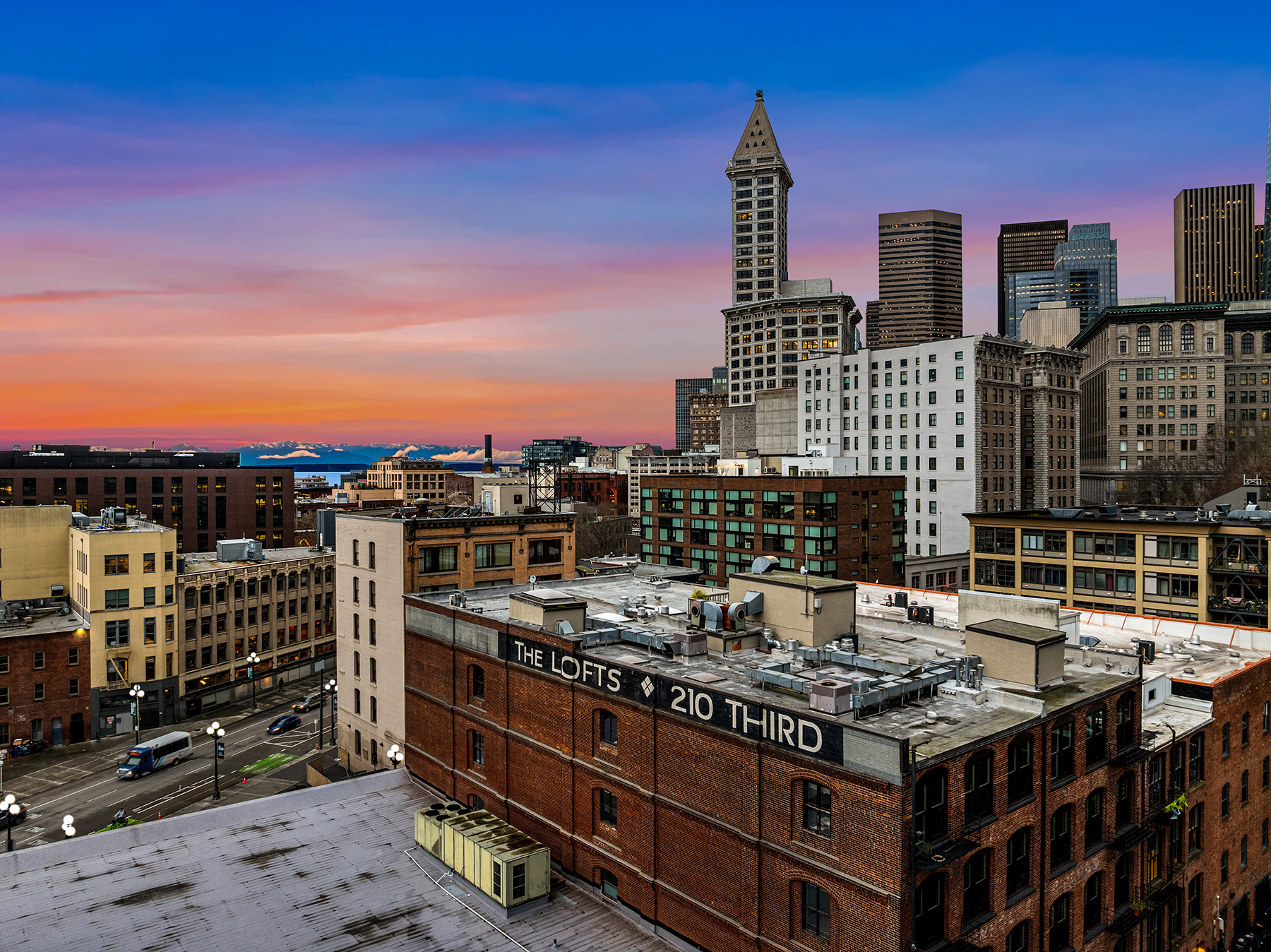 The Lofts at 210 Third, Pioneer Square Seattle at sunset with Smith Tower